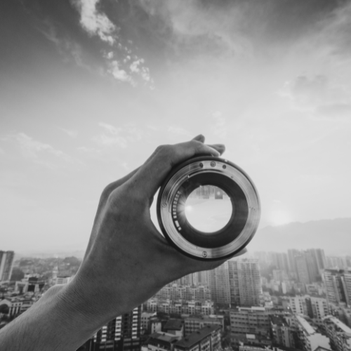 Camera lens over a city